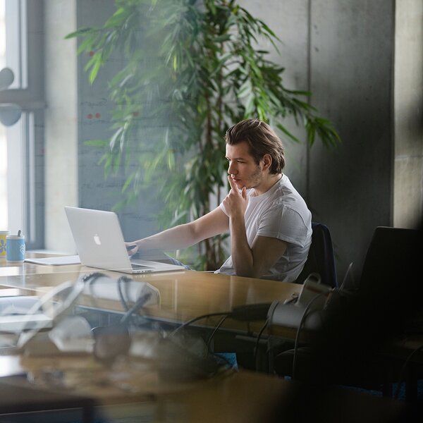 Person working on a laptop / Thoughtful and concentrated